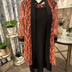 Stylish Black Dress with Vibrant Red Patterned Jacket